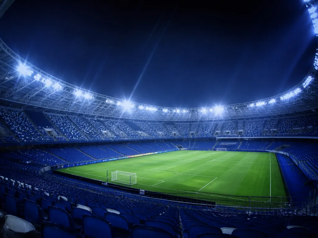 Tom europeisk fotbollsarena i strålkastarljus, symbol för Champions League-turneringen