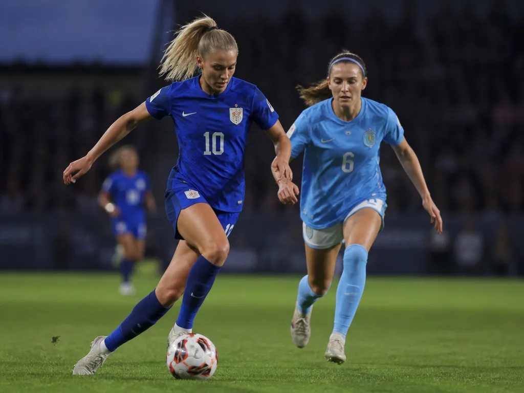 Damfotbollsspelare i aktion på en professionell gräsplan under OBOS Damallsvenskan